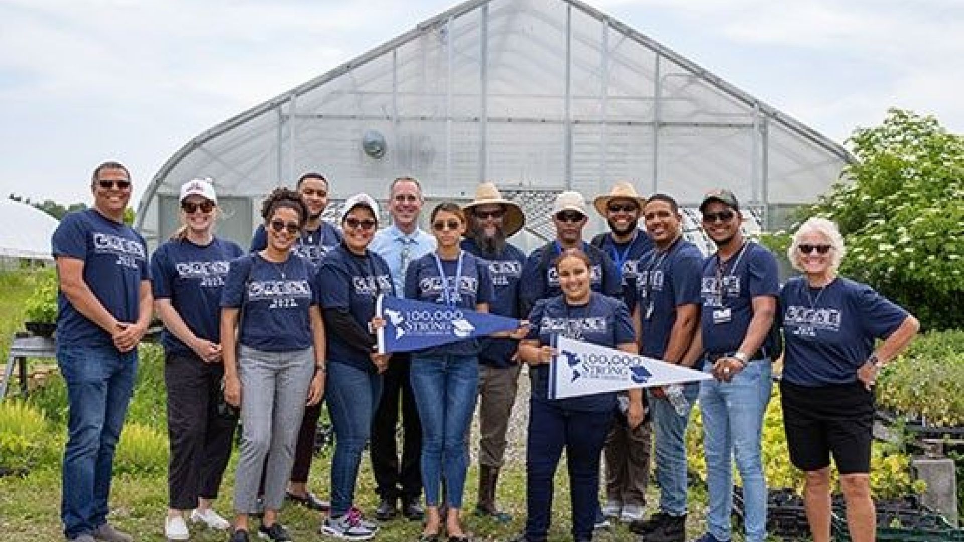 Students and administrators pose at TC3 Farm