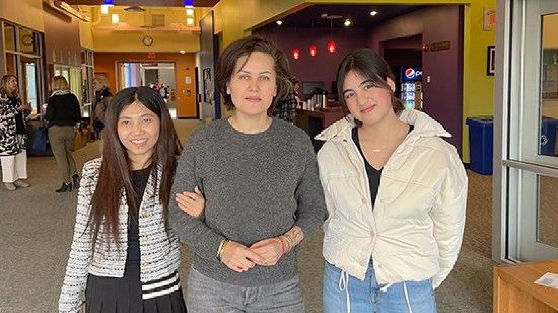 Filmmaker with two students