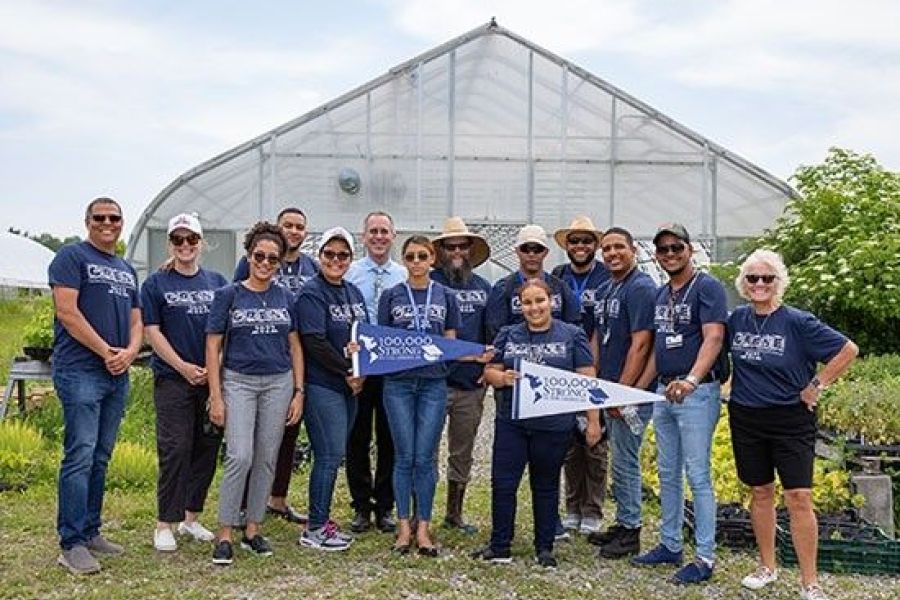 Students and administrators pose at TC3 Farm