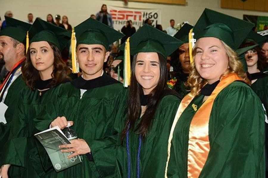 Graduates smiling at commencement