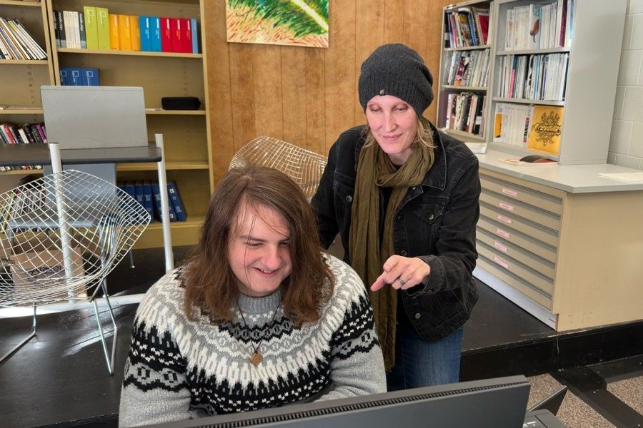  Christine Shanks working with a smiling student