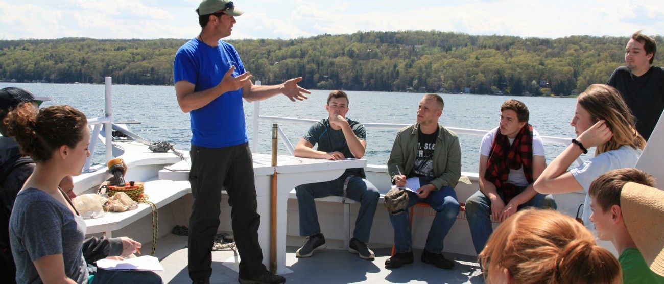 Instructor talking to students on boat