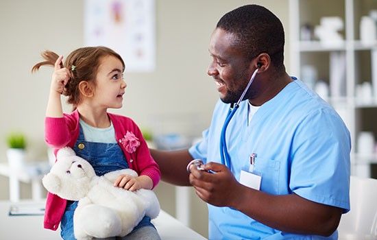 medical assistant with a child patient
