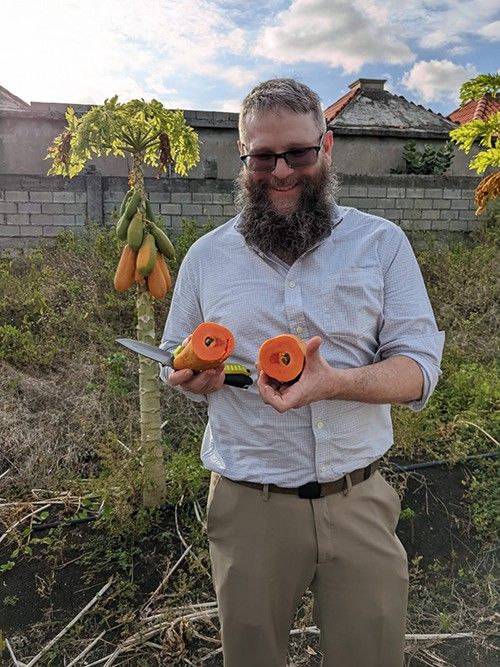 Farmer Todd with fruit in the Dominican Republic